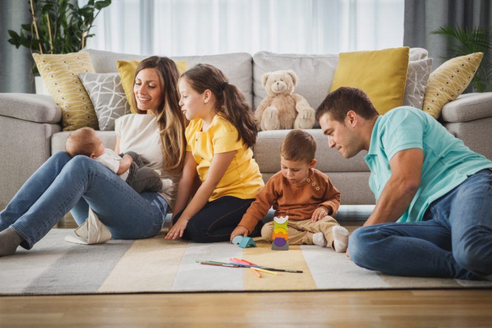 Family playing together in a cozy living room